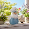 Kapitänsfigur 16cm Polyresin Blau-Weiß mit Brille und Mütze | Floristik21.de